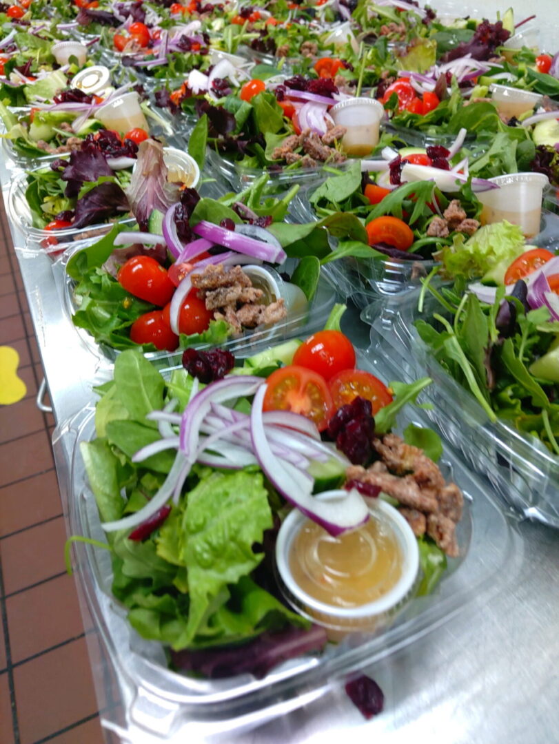 Fresh catered salad bowls prepared for Bay Area corporate office lunch delivery