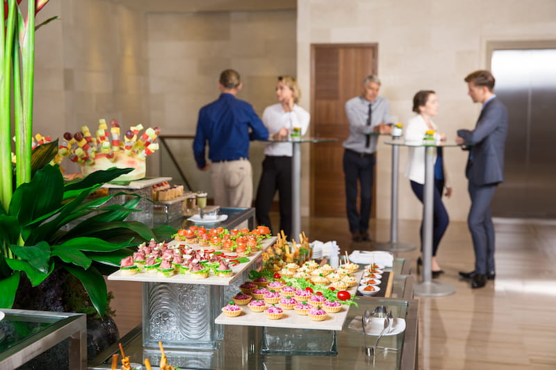 Corporate catering buffet set up in an office lobby during a company event