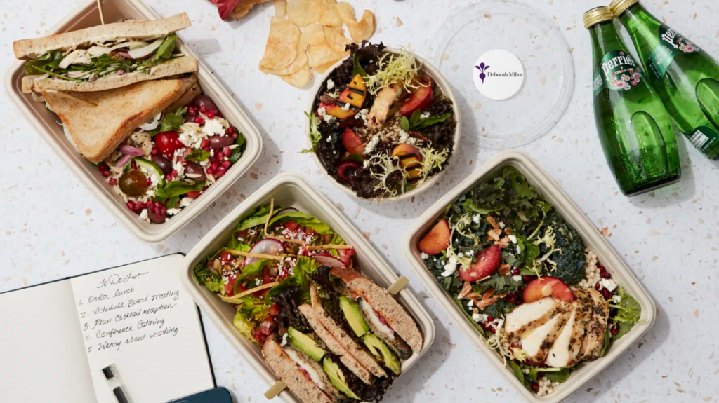 Flat lay of varied meal prep containers for a weekly office lunch rotation