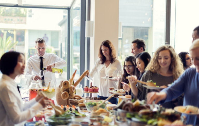Diverse group of Silicon Valley employees enjoying a catered office lunch