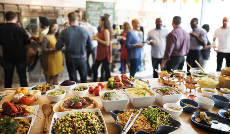 Corporate networking event with a large catered buffet spread